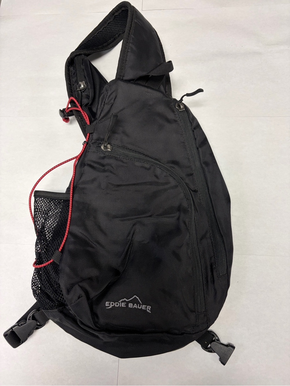 Eddie Bauer Black Sling Bag with Red Accent Cord